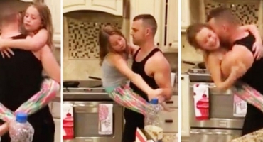 Баща танцува с дъщеря в кухнята...